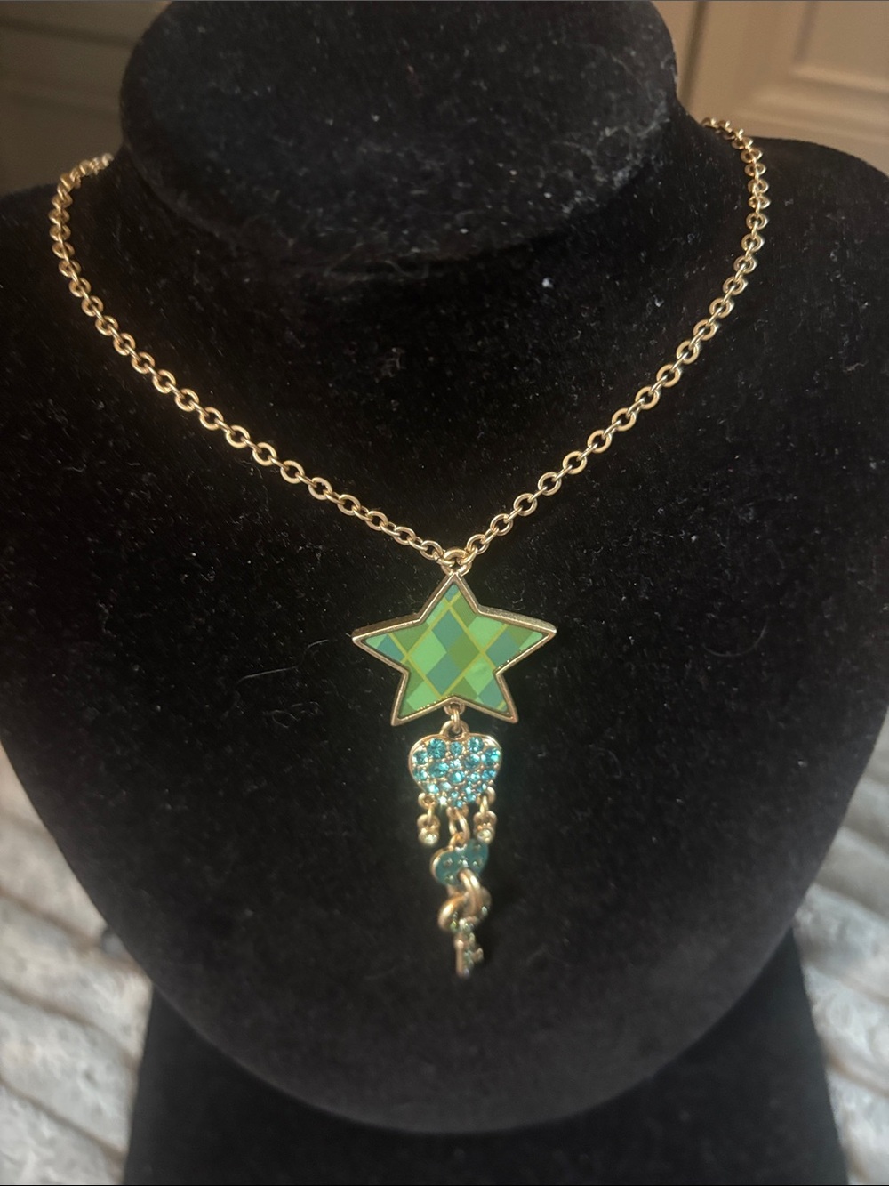 Pilgrim Danish Designs Goldtone  Necklace with Green Star and and blue Charms.